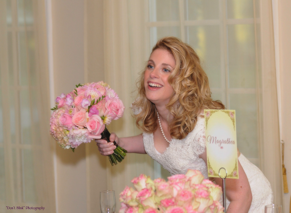 Bride holding a pink and white bouquet