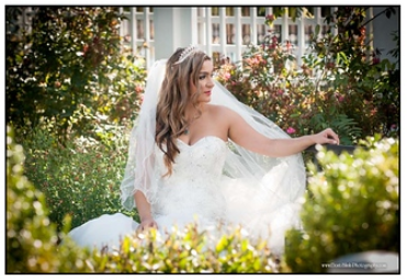 woman in wedding dress in a flower garden