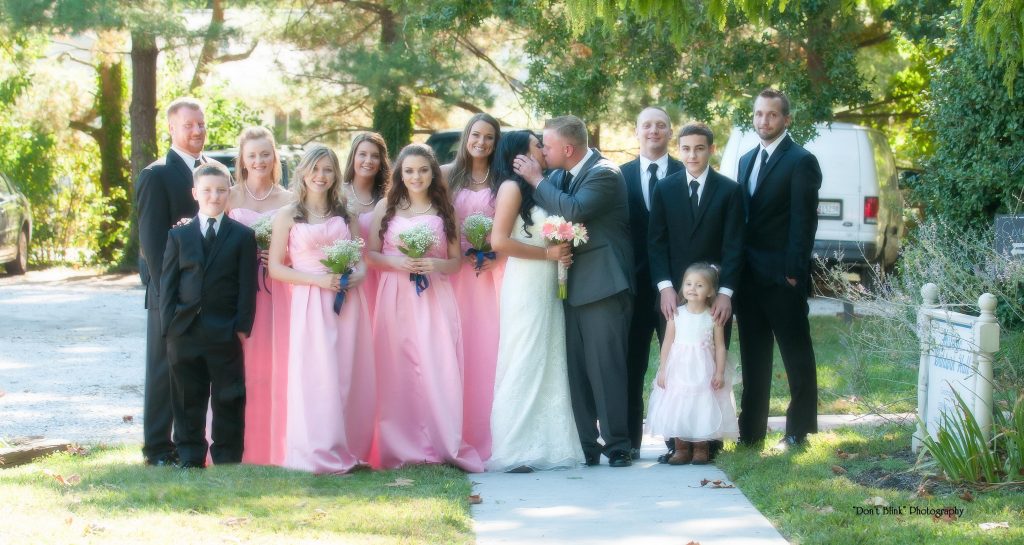Group from wedding with bridesmaids in blue