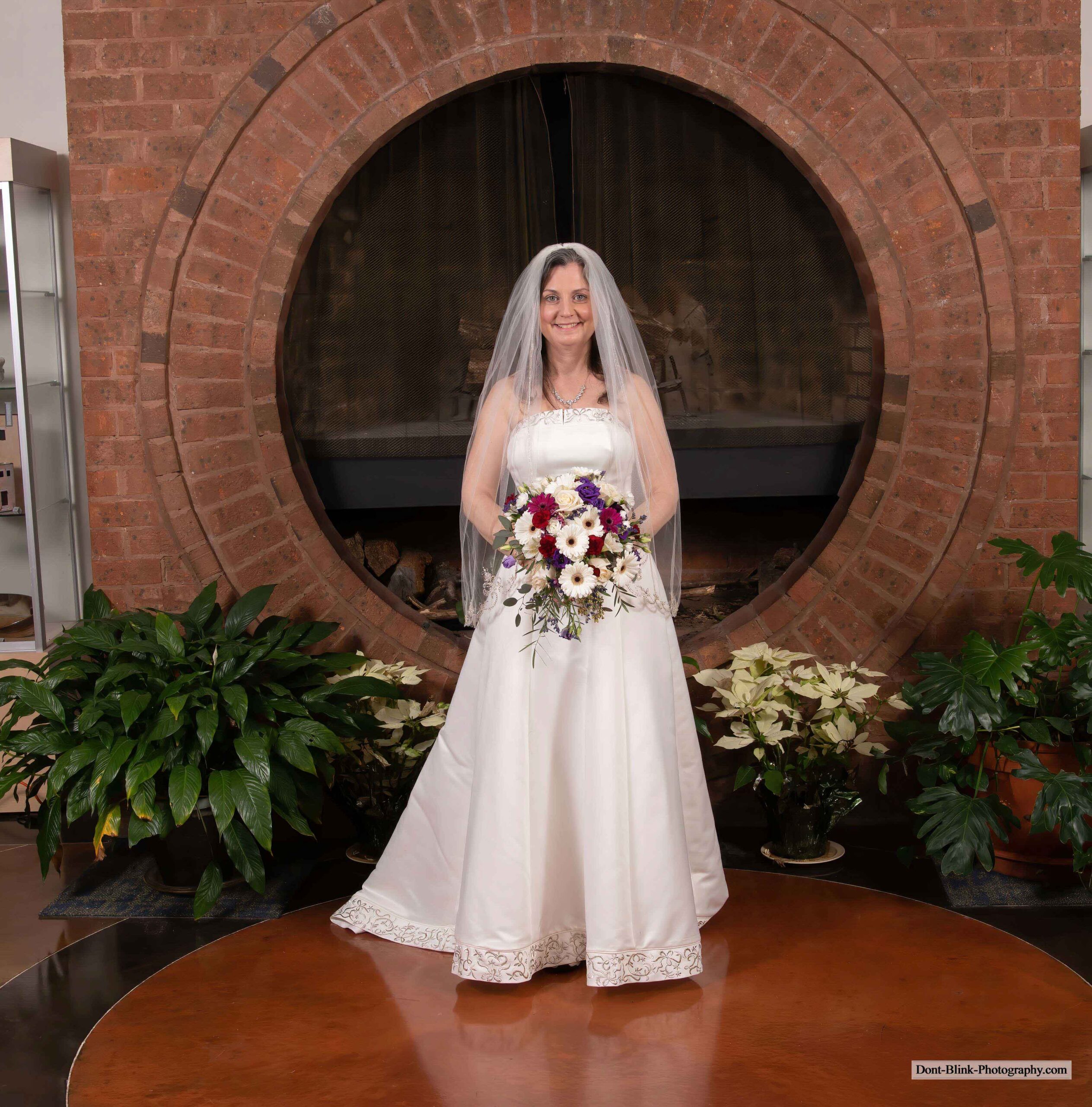 Bride leans forward in dress