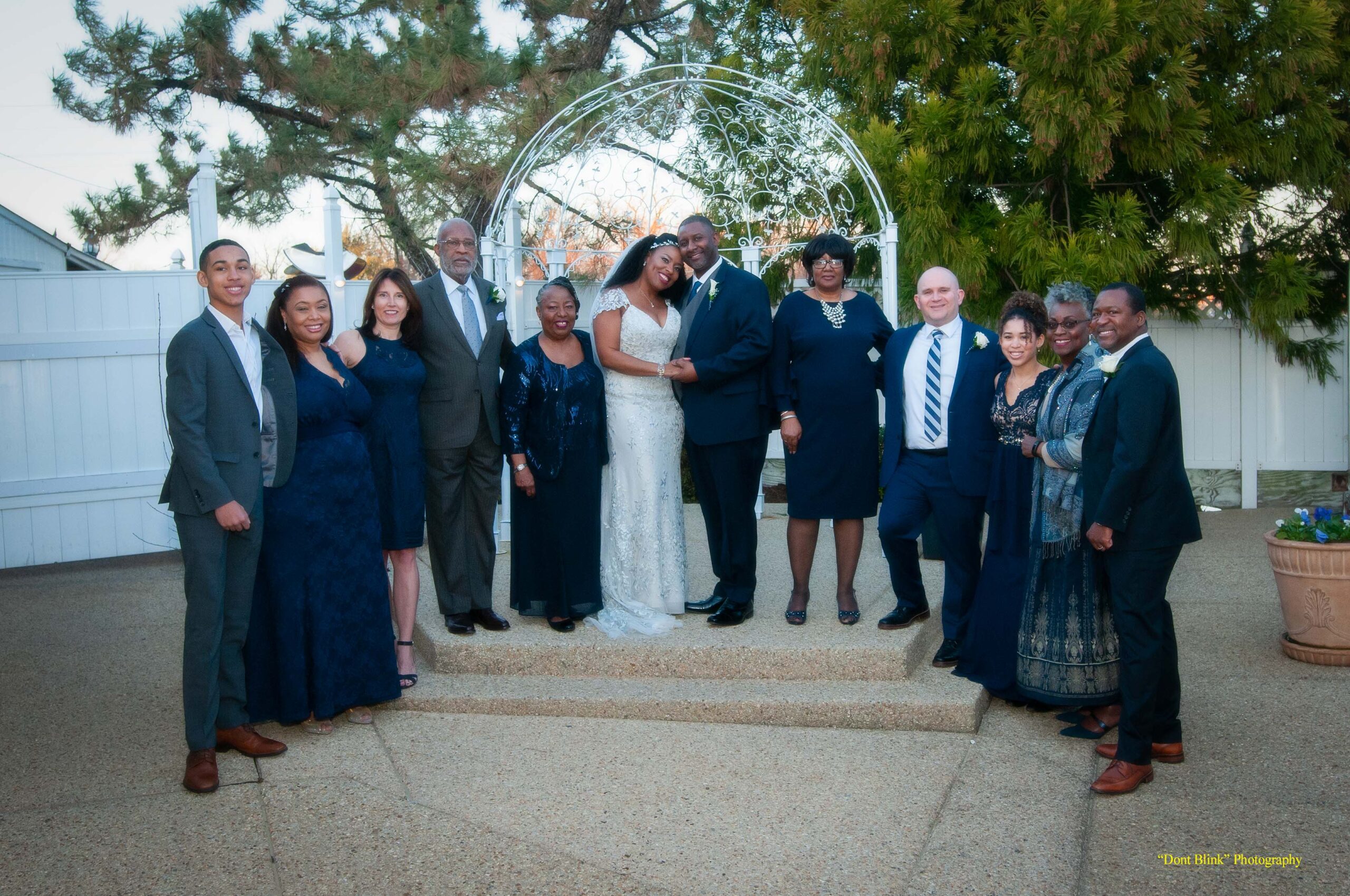 Group from wedding with bridesmaids in blue